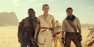 Rey, Finn, Poe, Chewie and C-3PO on a desert planet