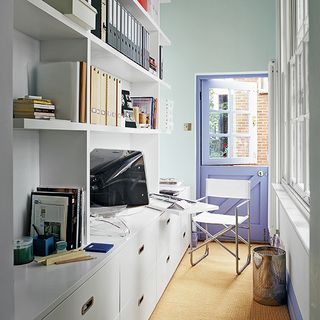 home office with white wall unit