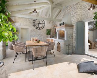 Large covered terrace at a mediterranean stone house