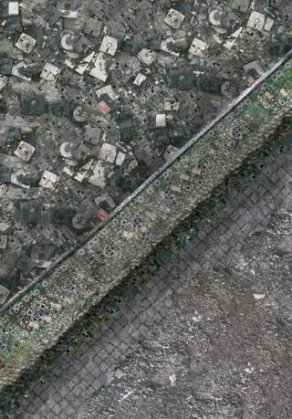 An aerial view of the ground being covered with old electronics.