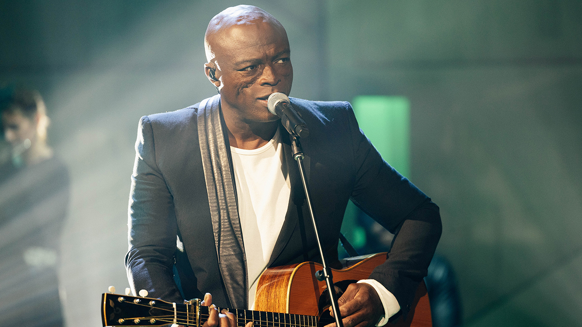 Singer-songwriter Seal playing acoustic guitar 