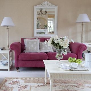 living room with pink sofa