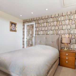 bedroom with book shelve wallpaper