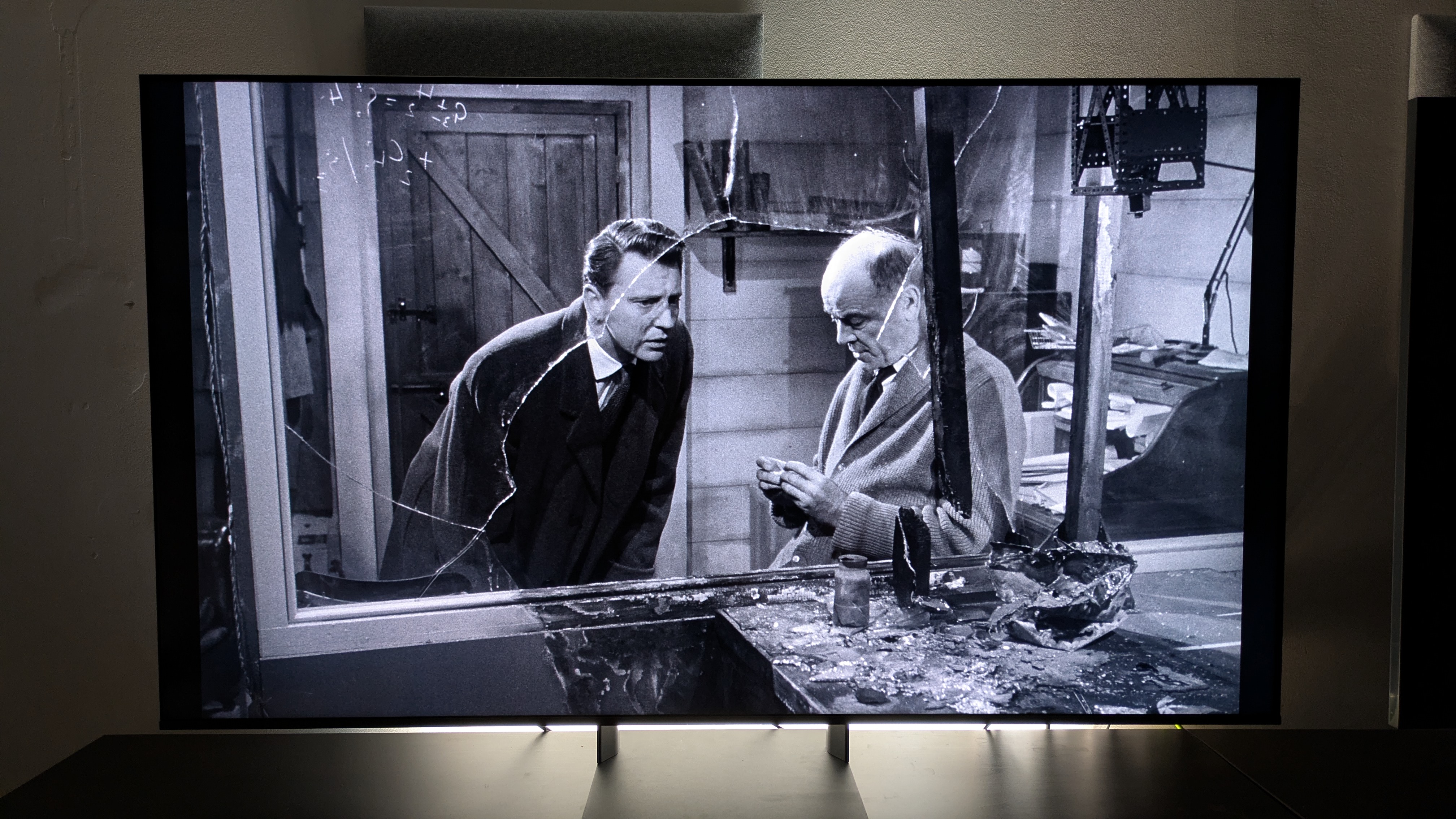 X: The Unknown 4K Bu-ray showing two men by broken glass in a lab