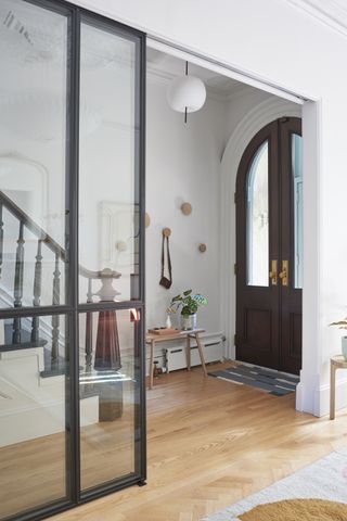 An entryway with parquet wooden flooring