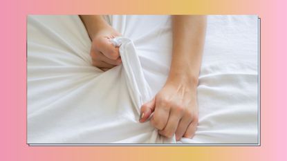 Hand sign orgasm of woman on white bed , Hand of female pulling white sheets in ecstasy , feeling and emotion concept