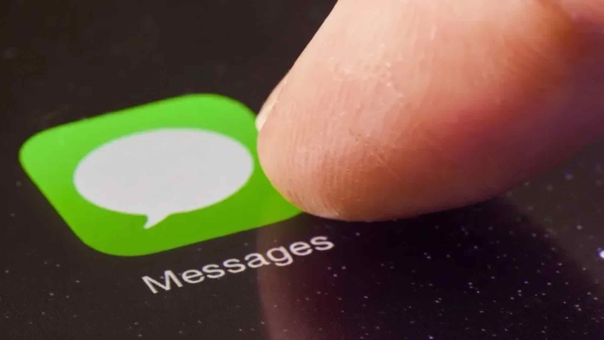 Apple Messages icon with finger on iPhone