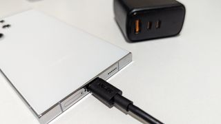 Samsung Galaxy S24 Ultra charging via a USB-C cable.