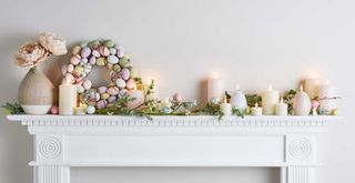 Ester mantel decor with egg wreath in pastels with flameless candles and garland