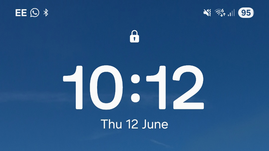 A screenshot of One UI 7 with the lock screen clock and top bar icons visible