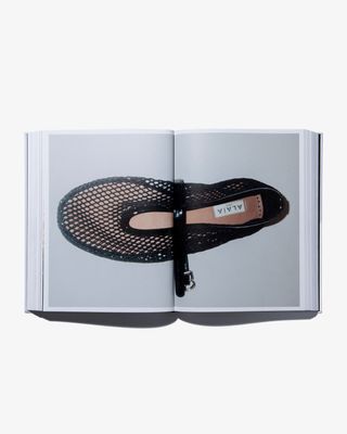 Open pages of ‘Alaïa by Seklaoui’ book, showing black mesh shoe