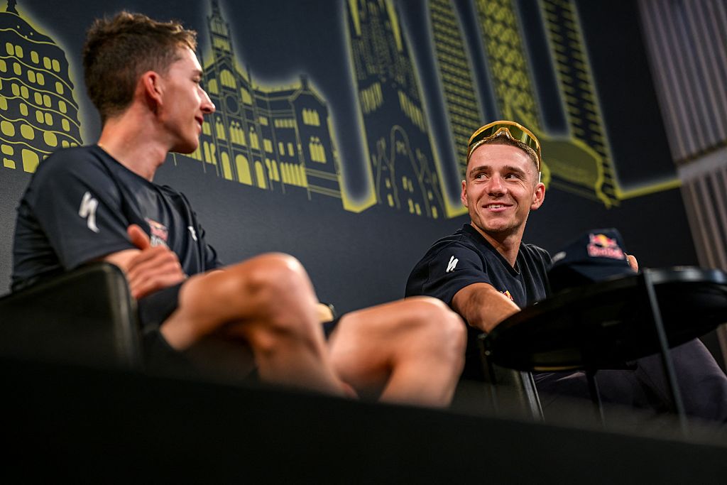 Florian Lipowitz (L) and Remco Evenepoel in the pre-Tour de France press conference 2026