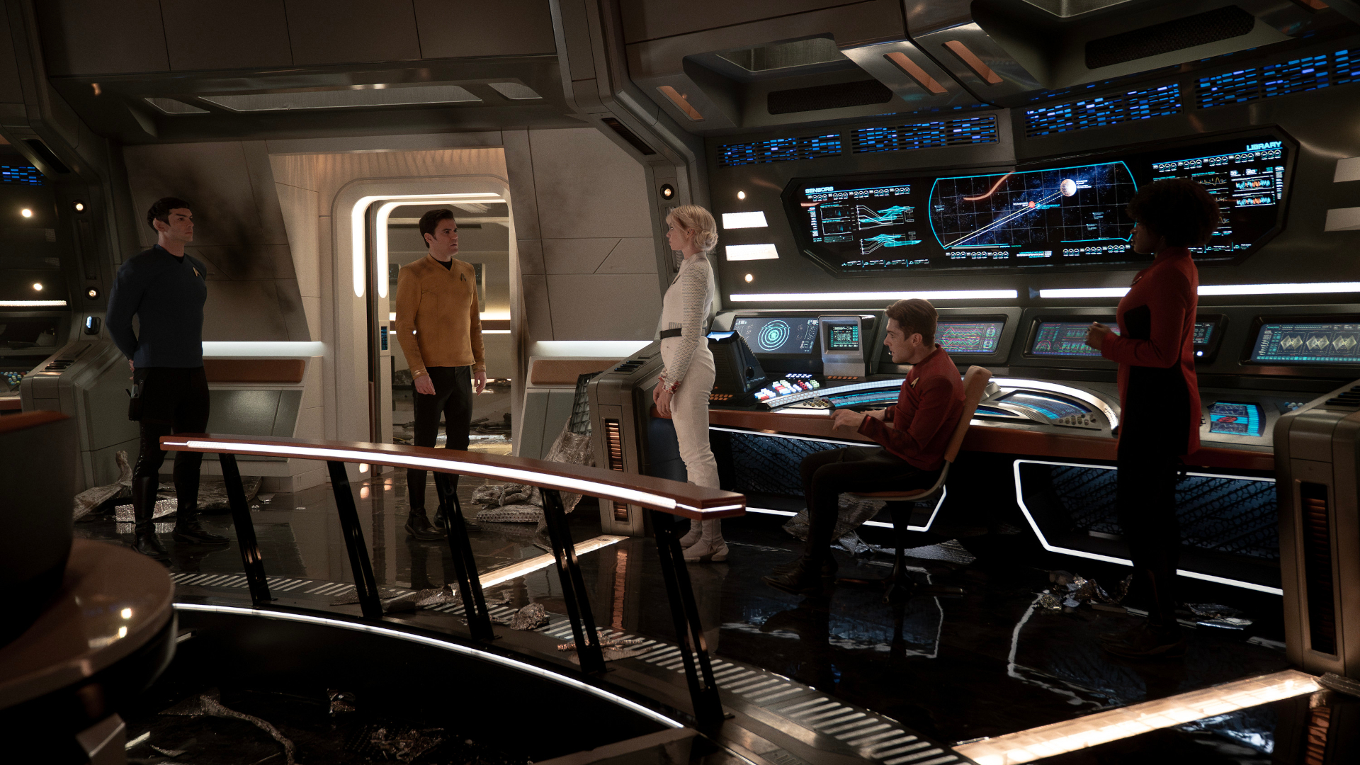 L to R Ethan Peck as Spock, Paul Wesley as Kirk, Jess Bush as Chapel, Martin Quinn as Scotty and Celia Rose Gooding as Uhura in season 3 , Episode 6 of Strange New Worlds streaming on Paramount+. Photo Credit: Marni GrossmanParamount+