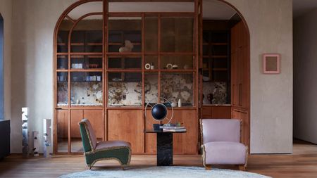 a small kitchen with a glass partition screen