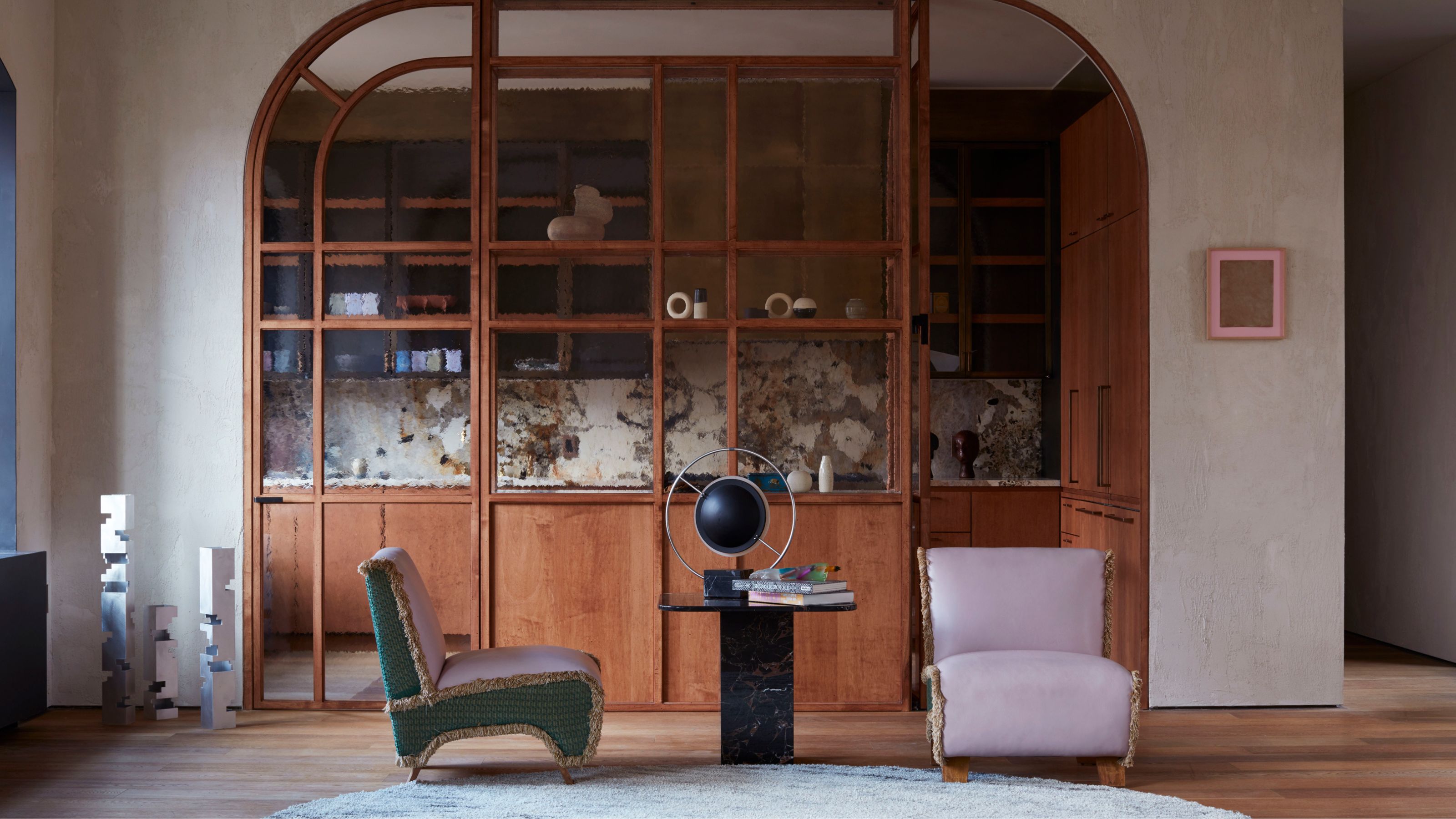 a small kitchen with a glass partition screen