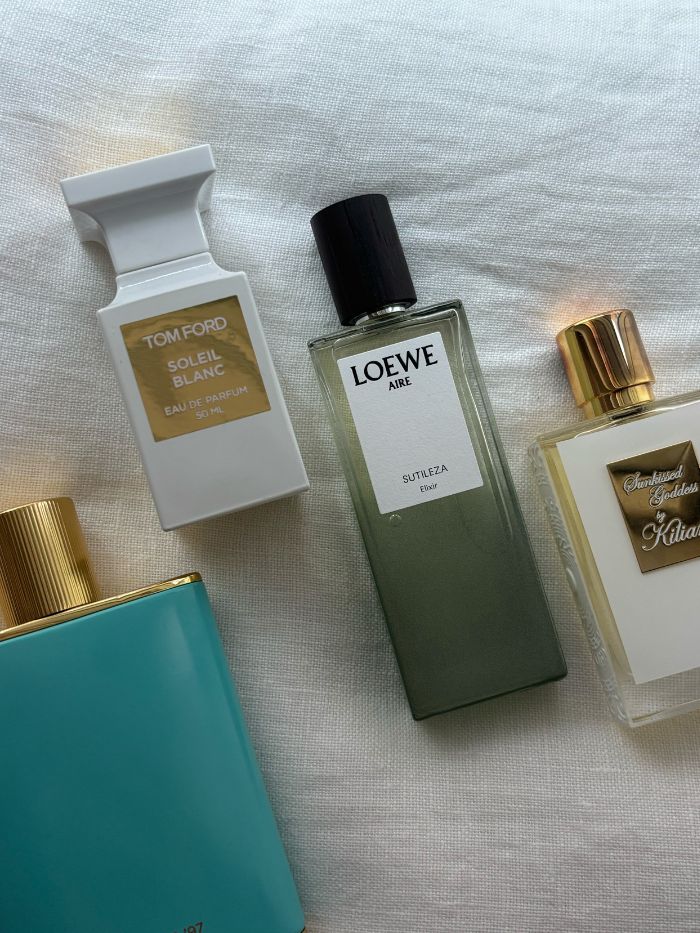 A picture of some of the best Euro Summer perfumes, including Victoria Beckham Beauty, Tom Ford, Loewe and Kilian