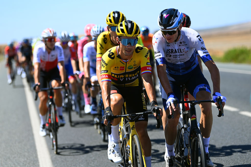TOMARES SPAIN SEPTEMBER 06 LR Primoz Roglic of Slovenia and Team Jumbo Visma and Christopher Froome of United Kingdom and Team Israel Premier Tech compete during the 77th Tour of Spain 2022 Stage 16 a 1894km stage from Sanlcar de Barrameda to Tomares LaVuelta22 WorldTour on September 06 2022 in Tomares Spain Photo by Tim de WaeleGetty Images