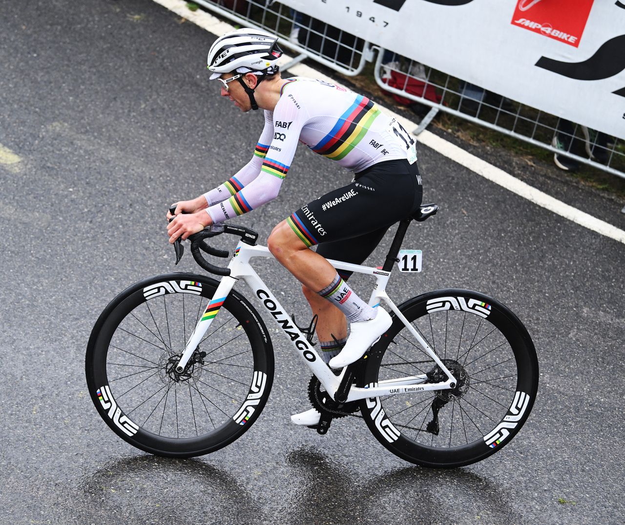Tadej Pogacar racing in the rainbow jersey