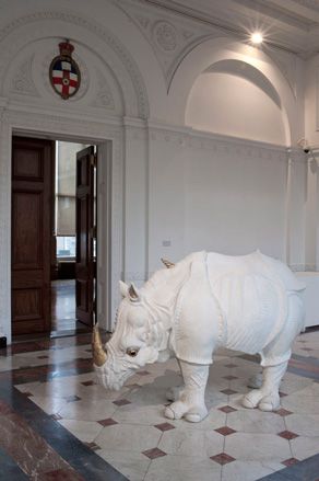 Pointing visitors towards the entrance of the exhibition is 'Zouzou' the rhinoceros in white ostrich skin