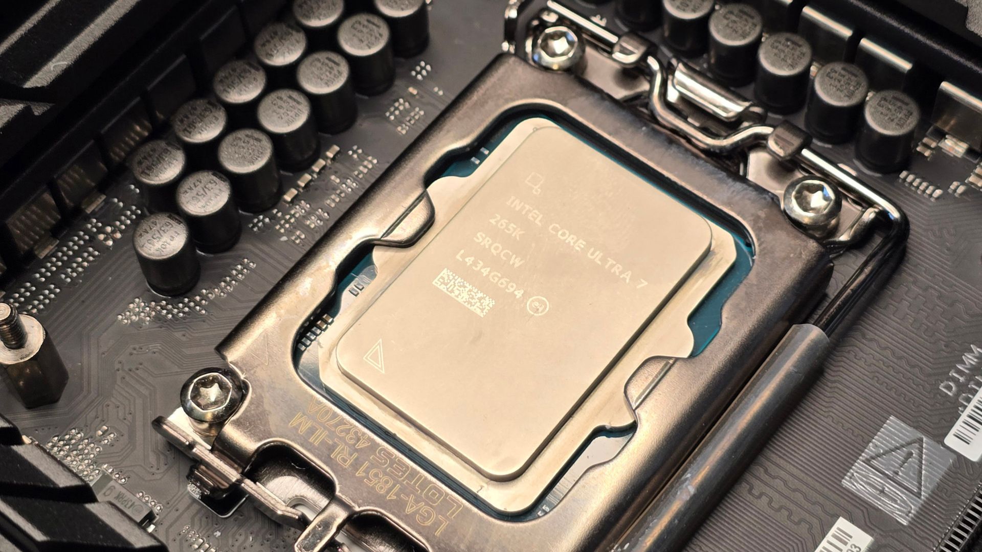A close up of the Intel Core Ultra 7 265K installed on its motherboard socket