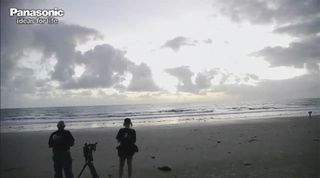 Eclipse watchers stand on a beach in Australia, awaiting the total solar eclipse of November 2012.