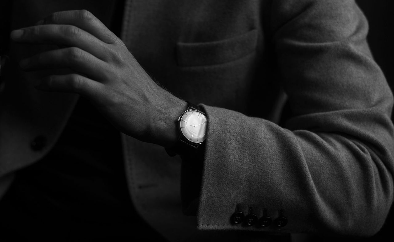 Man&#039;s wrist with a Sekford watch on