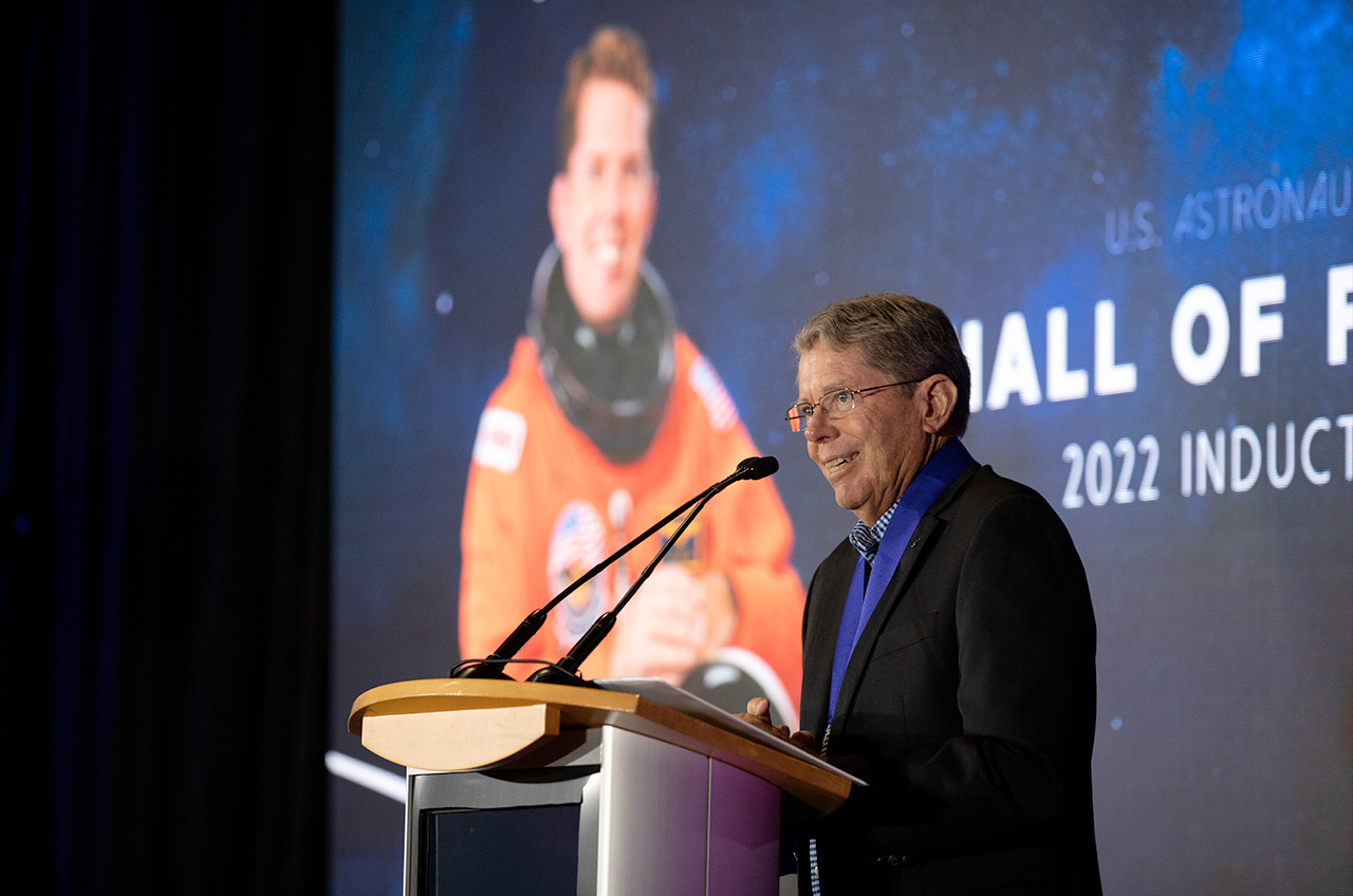 Three-time space shuttle mission specialist David Leestma speaks at his induction into the U.S. Astronaut Hall of Fame on Sunday, June 11, 2022 at Kennedy Space Center.