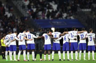 France players stand for the national anthem ahead of a friendly against Chile in March 2024.