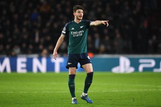 Arsenal star Declan Rice gives his team instructions during the UEFA Champions League match between PSV Eindhoven and Arsenal FC at Philips Stadion on December 12, 2023 in Eindhoven, Netherlands.