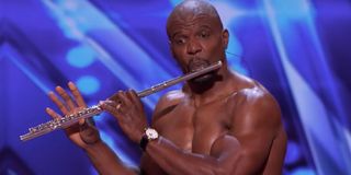 America's Got Talent Terry Crews playing the flute, shirtless