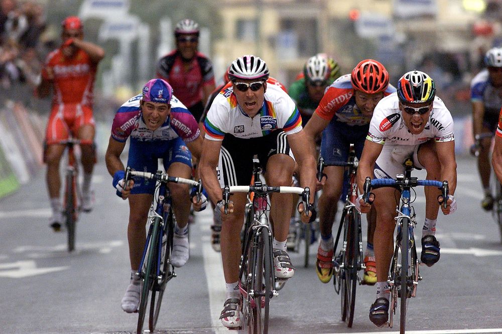 World Cup leader Erik Zabel (T-Mobile) on his way to beating Romans Vainsteins (Domo Farm Frites) and Mario Cippolini (Saeco) at Milan-San Remo in 2001.