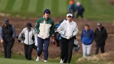 Charley Hull (left) and Georgia Hall walk during the 2025 Sunningdale Foursomes