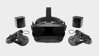 A Valve Index VR headset pictured with two controllers and base stations