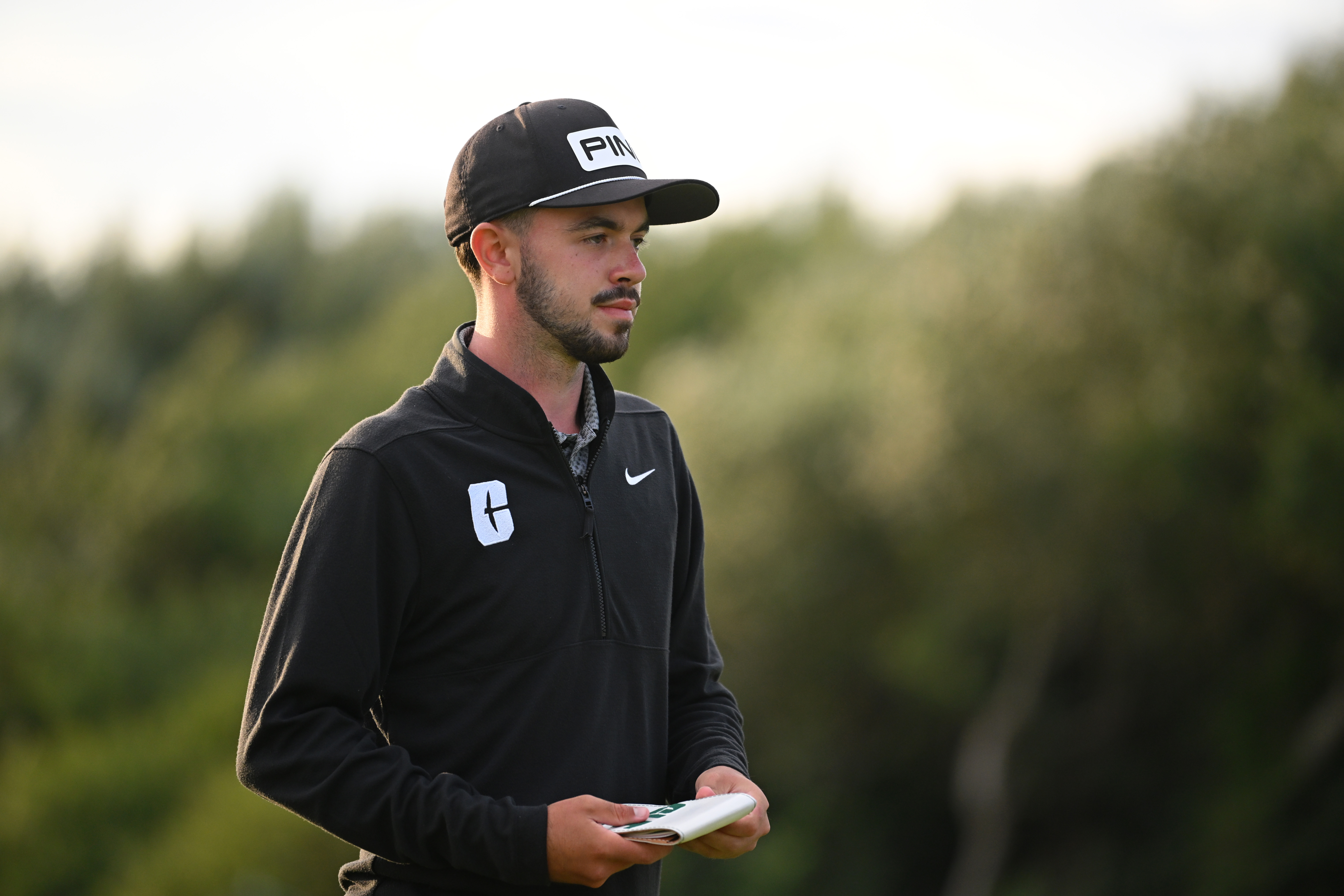 Frazer Jones looks at his yardage book