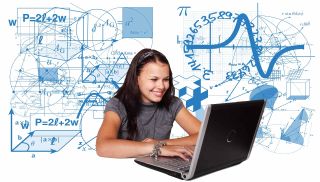 Smiling girl works on laptop computer in front of backdrop of equations and math symbols.