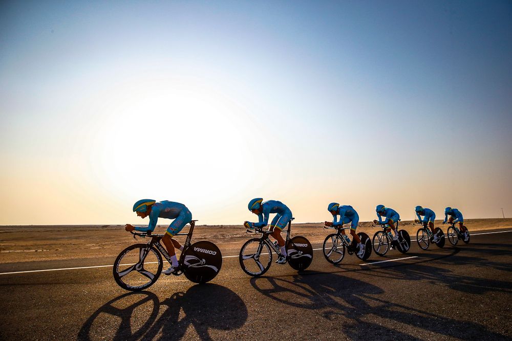 Astana riders compete in the team time trial under the sun in Doha, Qatar