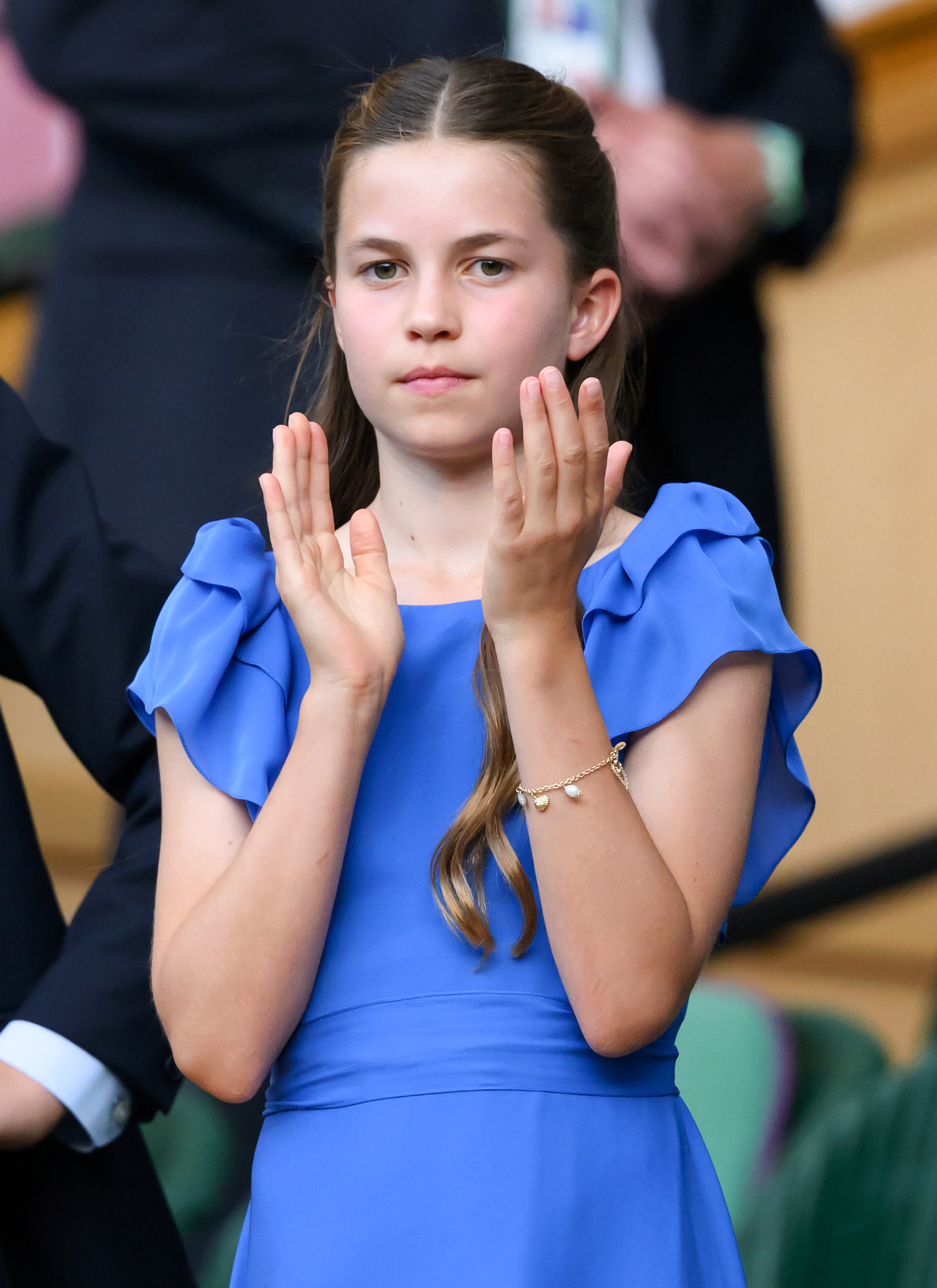 Princess Charlotte clapping in a blue dress