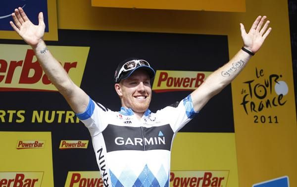 Stage three winner Tyler Farrar celebrates his victory on the podium.