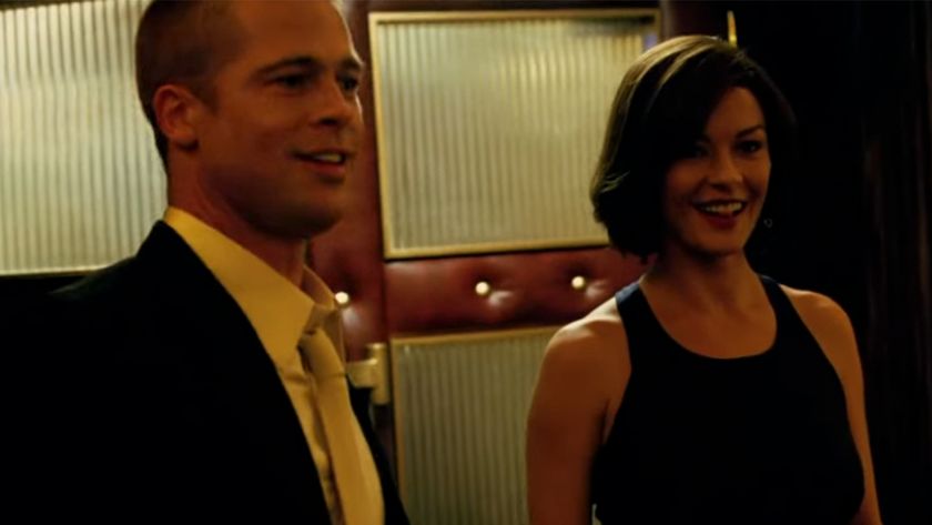Brad Pitt smiling next to Catherine Zeta-Jones in Ocean's Twelve