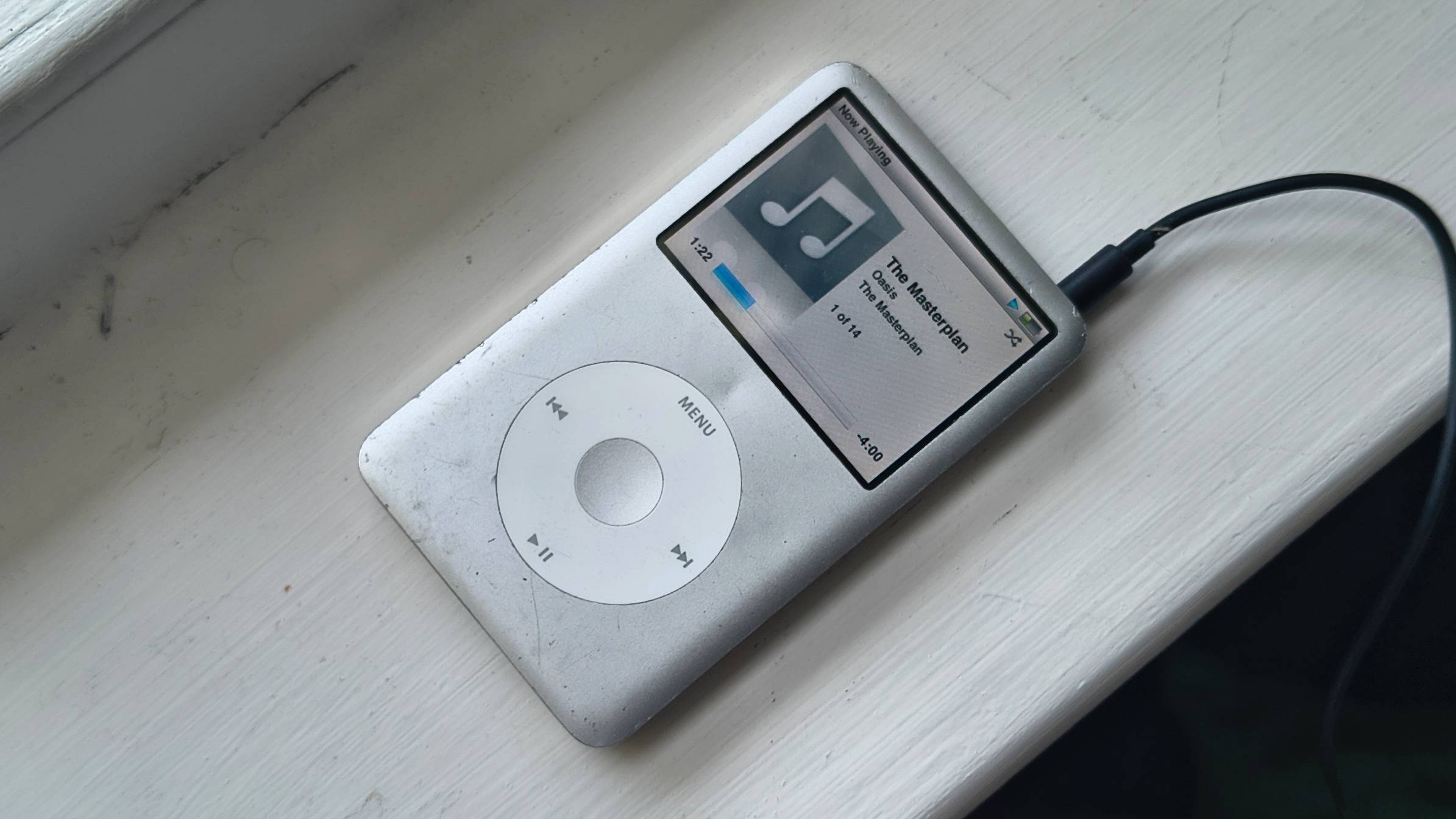 The iPod Classic on a window sill.