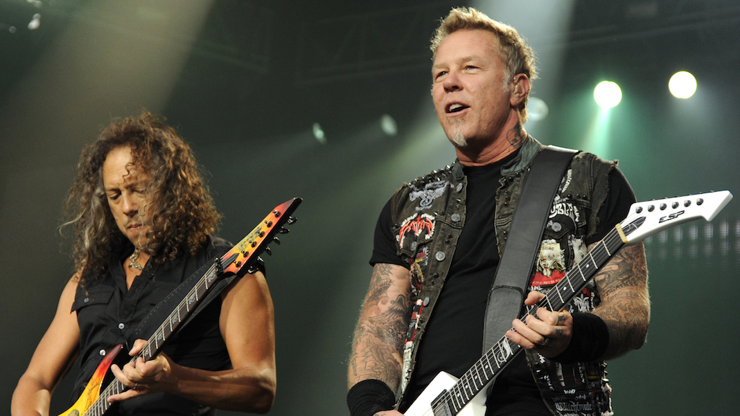 Kirk Hammett and James Hetfield onstage playing guitars