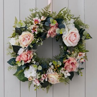 faux flower with wreaths and leaf