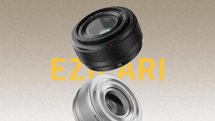 SG-Image AF 35mm f/2.2 promotional image showing black and silver lenses on a grey to tan gradient 