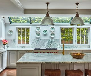 LA home kitchen with roof lights, cream cabinets and marble topped island