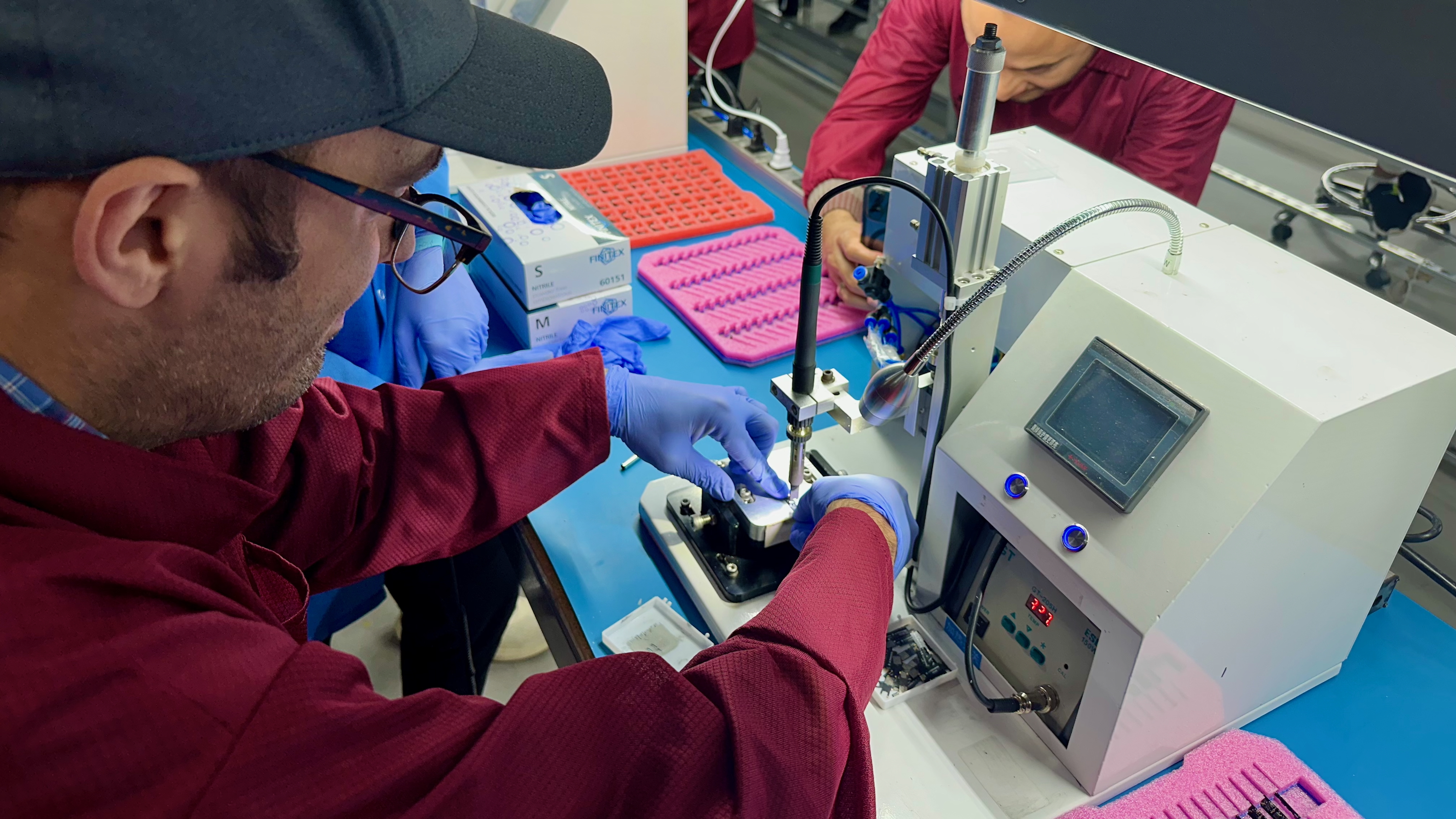 The author glueing the Ultrahuman Ring Air's PCB and Rx coil together.