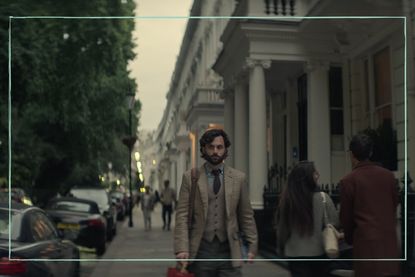 Penn Badgley as Joe Goldberg in You season 4 walking down a street in London