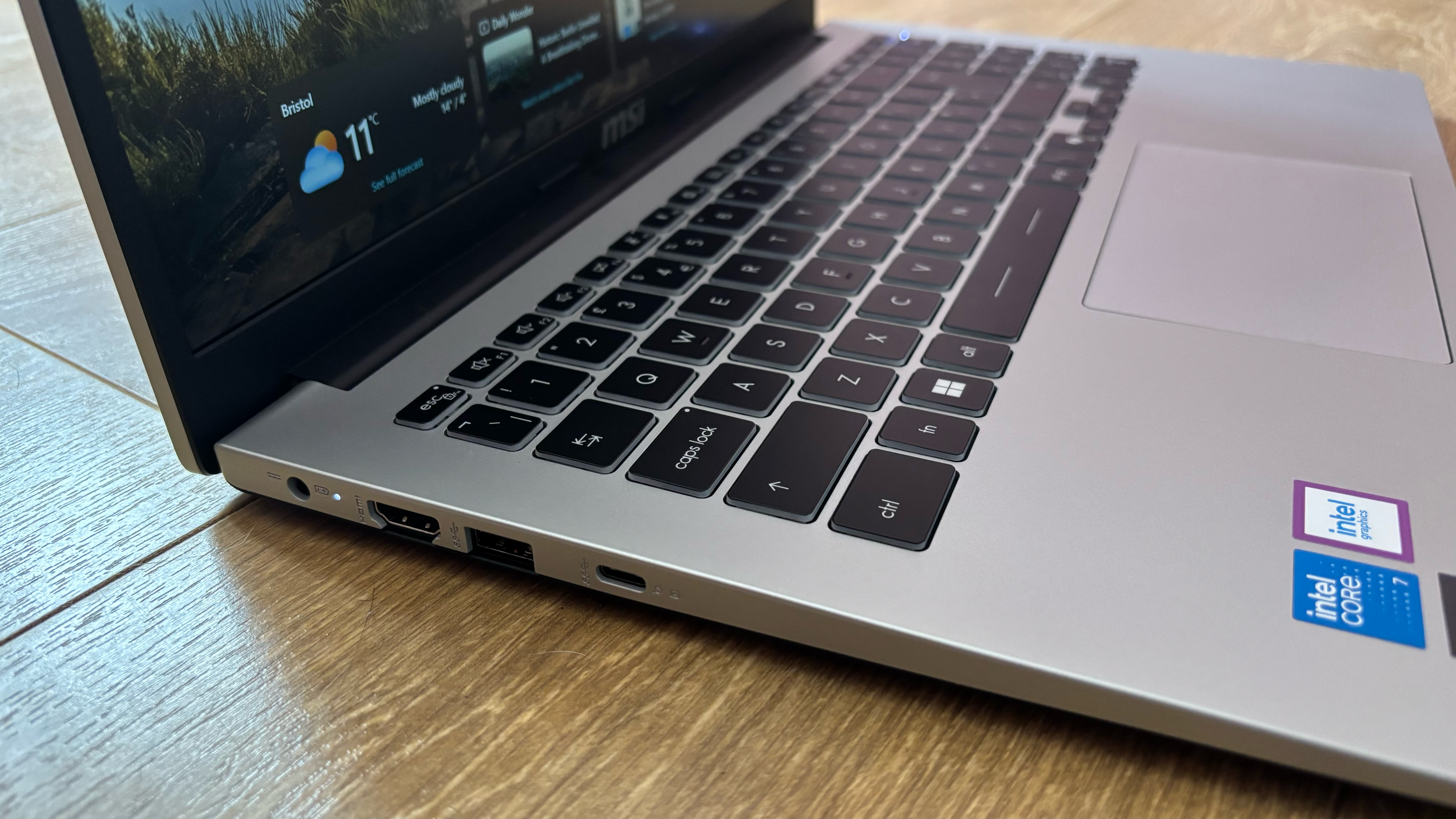 MSI Modern 15 laptop on a wooden desk