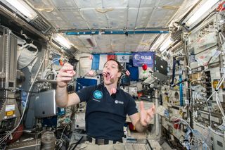 Astronaut Thomas Pesquet, who celebrated his 39th birthday at the International Space Station on Feb. 27, chows down on some French macarons that arrived on SpaceX's Dragon cargo craft on Feb. 23.