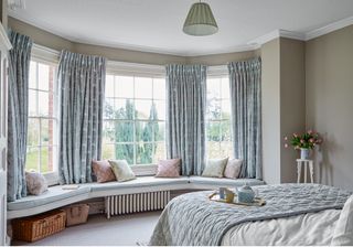 bedroom with large bay window and window seat