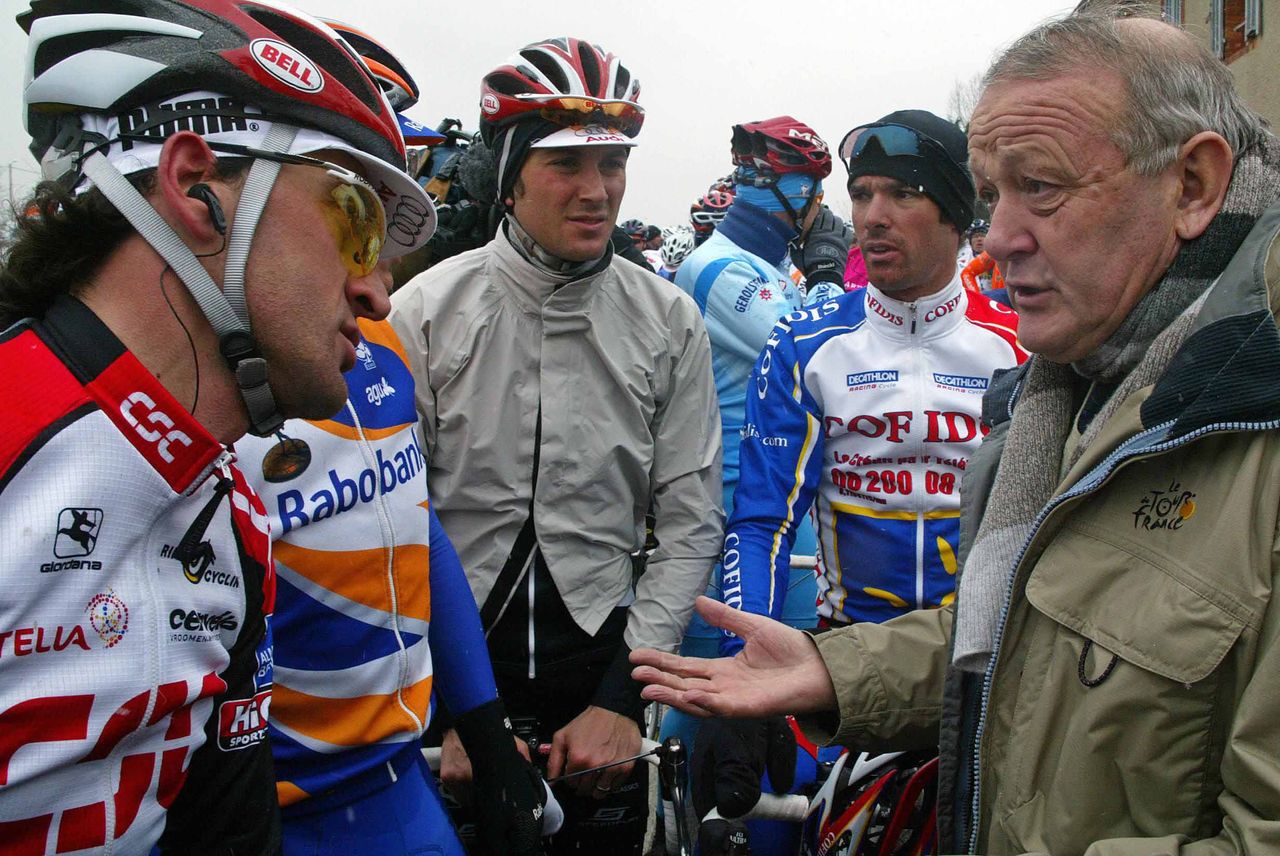Cold weather blighted Paris-Nice in 2004. Jean-Marie Leblanc tells Michele Bartoli, Ivan Basso and David Millar that stage 4 through the Auvergne has been cancelled.